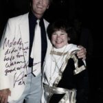 a man and woman photo with an autograph