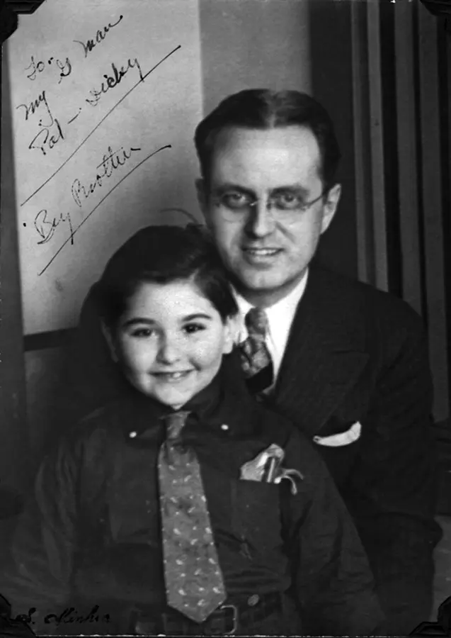 black and white photo of a man with his kid