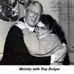 Melody and Ray Bolger are hugging