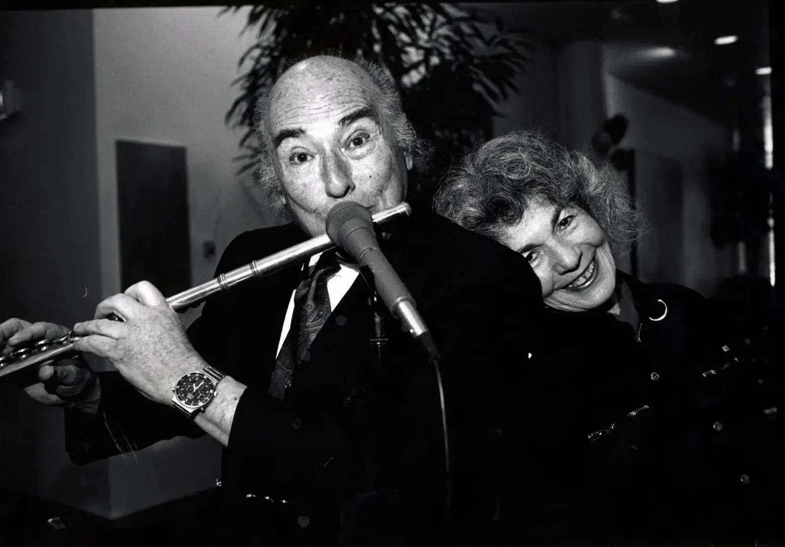 A black and white image of Dick Saunders playing flute with Lee
